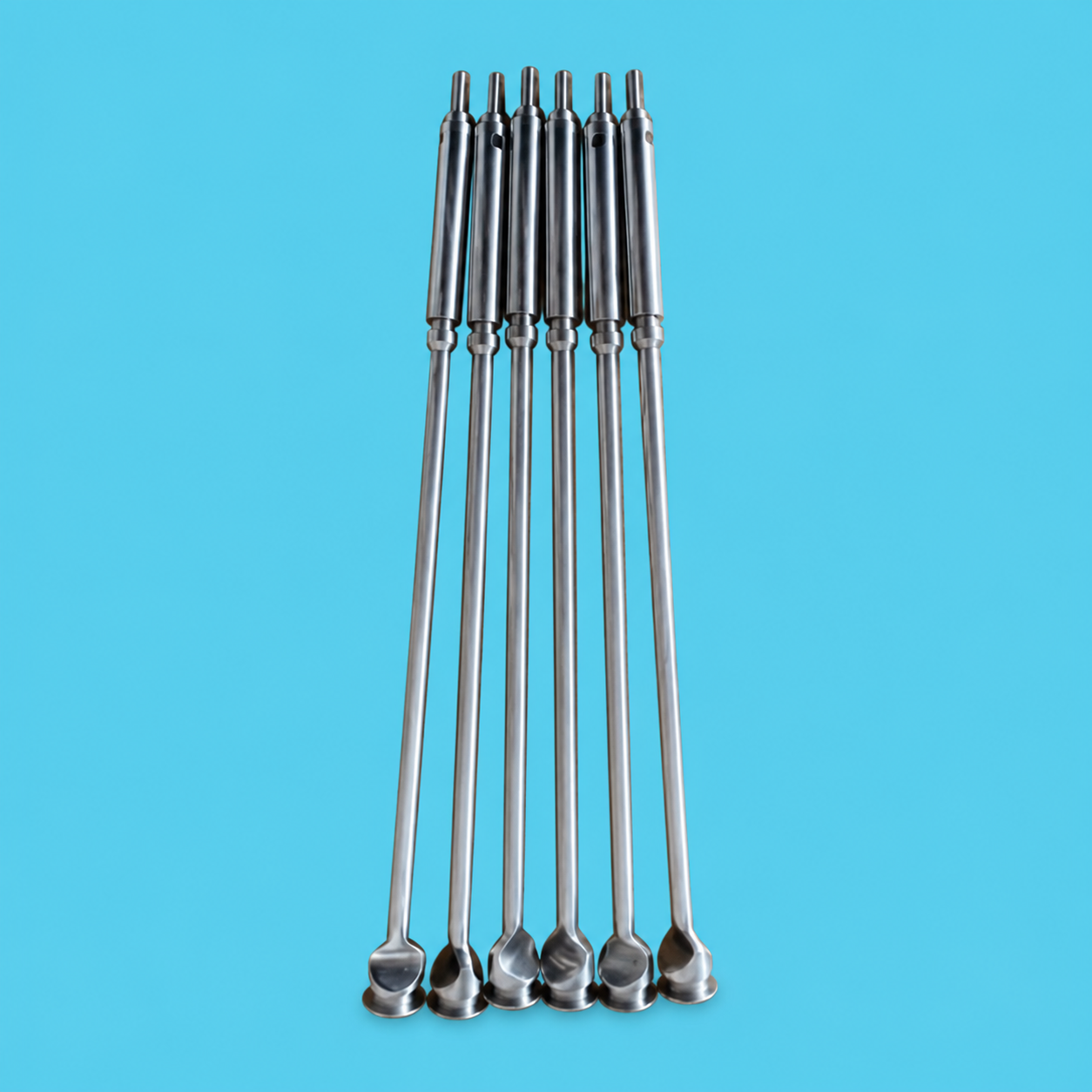 SIDEL-related filling valve needles photographed for spare part identification