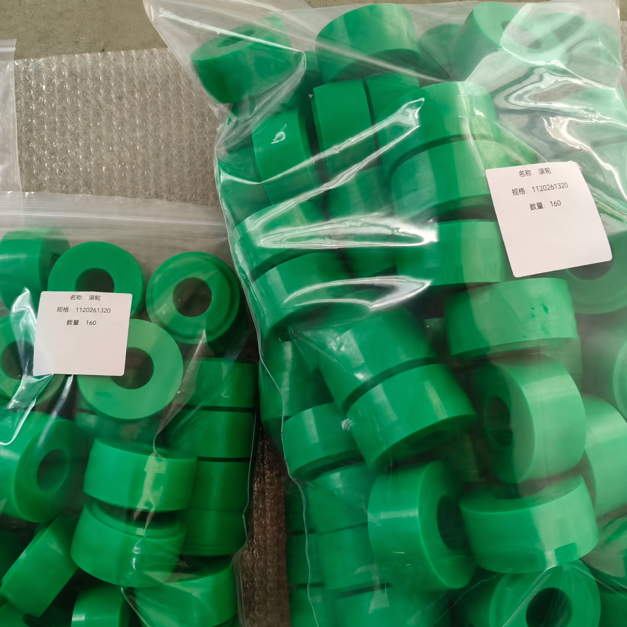 Labeled bags containing green cylindrical spare components